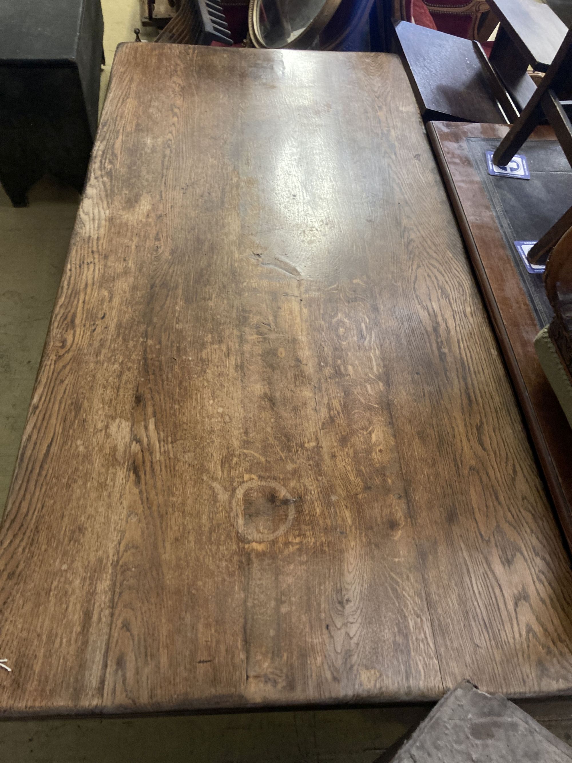 An early 20th century rectangular oak X frame refectory dining table, length 167cm, depth 80cm, height 75cm